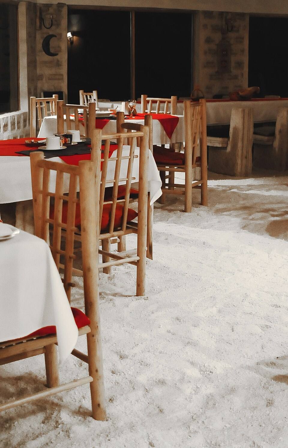 Tables and chairs inside Luna Salada in an accommodation photograph.